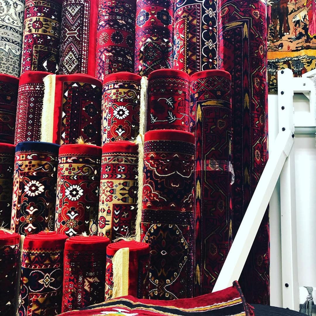 Rolled Red Rugs Display